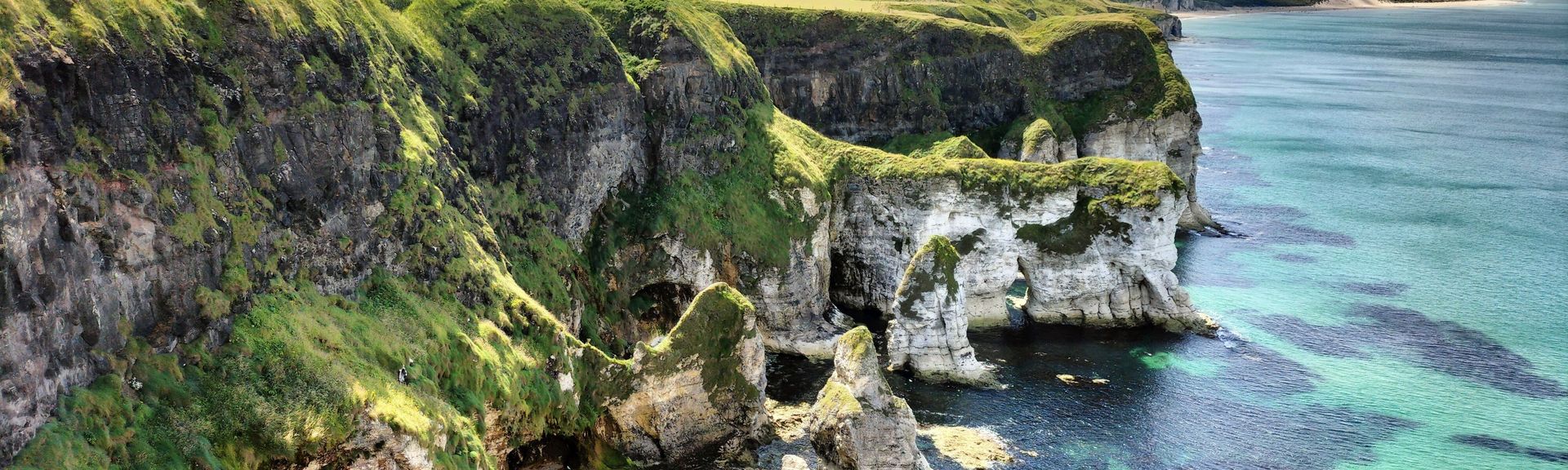 Scenic view of rugged cliffs and turquoise sea at White Ro